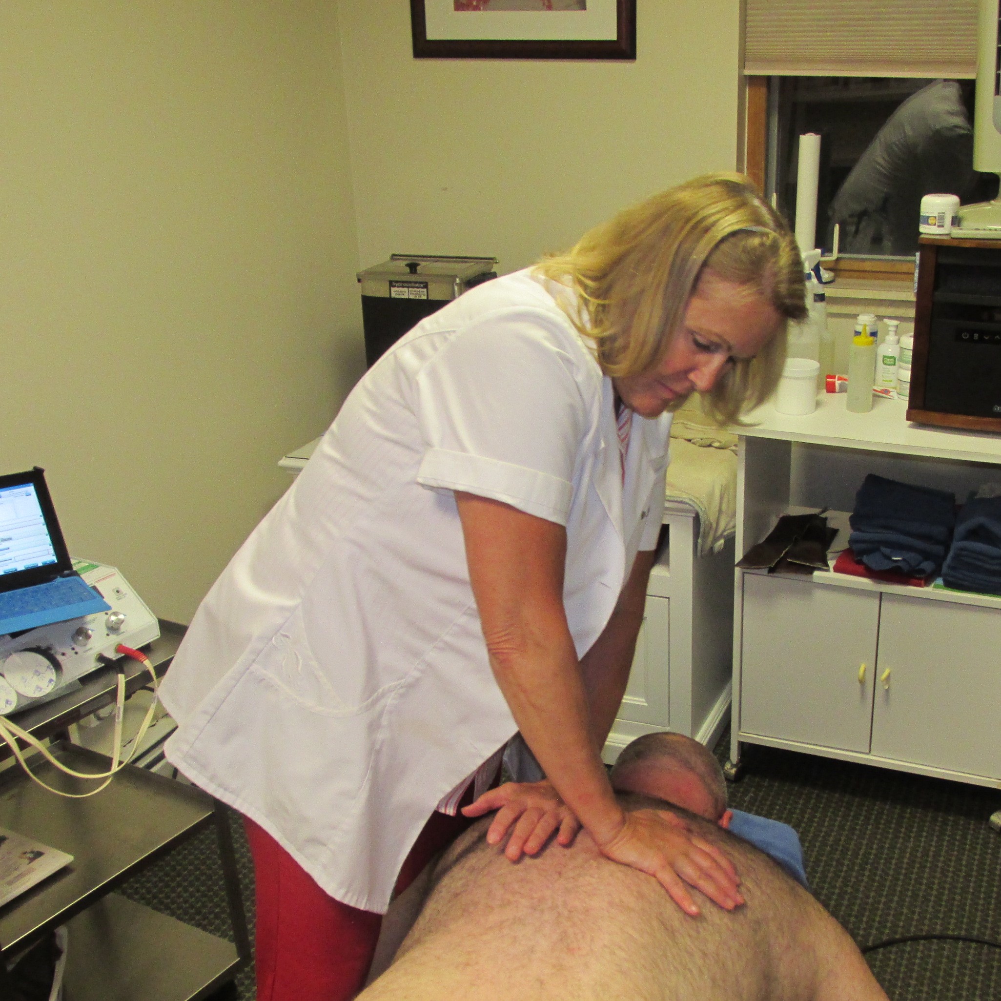 Dr. Mary Negri Chiropractor Adjusting Patient